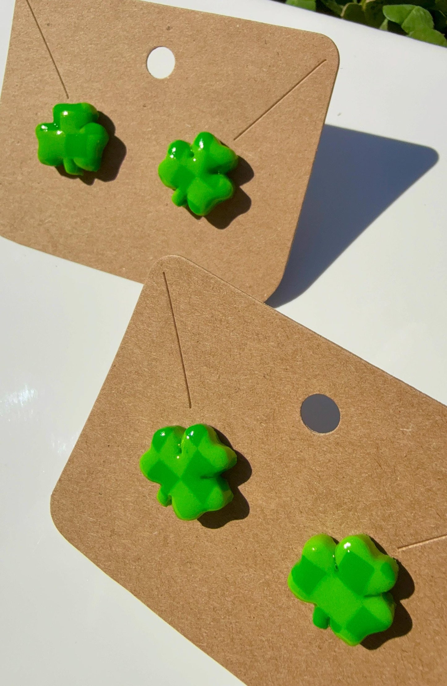 Handmade polymer clay checkered shamrock earrings